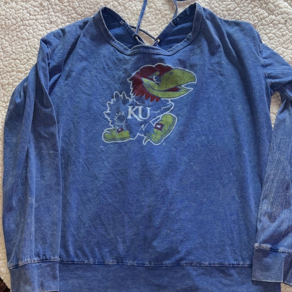 KU Blue Women’s long sleeve T with Rock Chalk and lace up in back